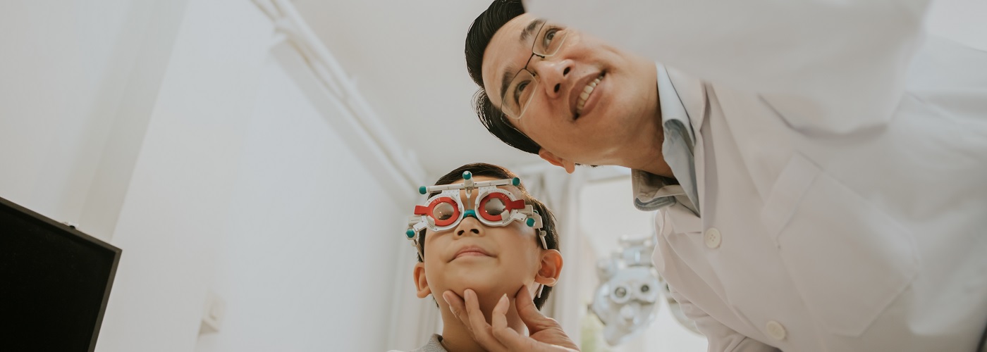 An eye specialist conducting a thorough vision examination on a patient